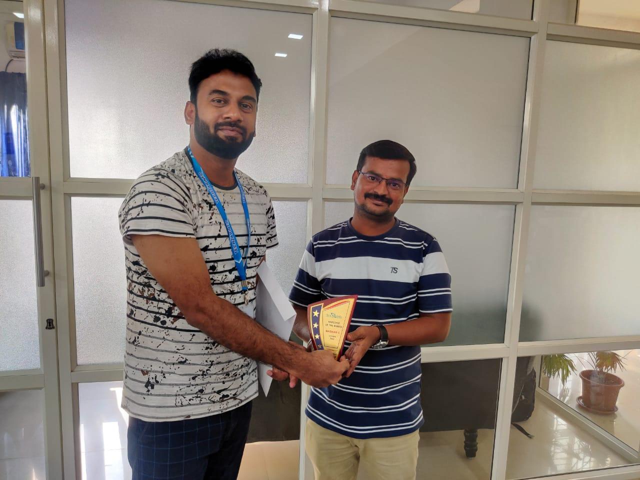 Mr-Baskar-receiving-employee-of-the-month-award-for-January-2022.jpeg