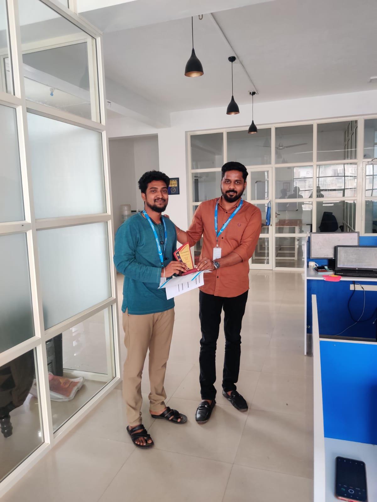 Mr-Sridharan-receiving-employee-of-the-month-award-for-July-2021.jpeg